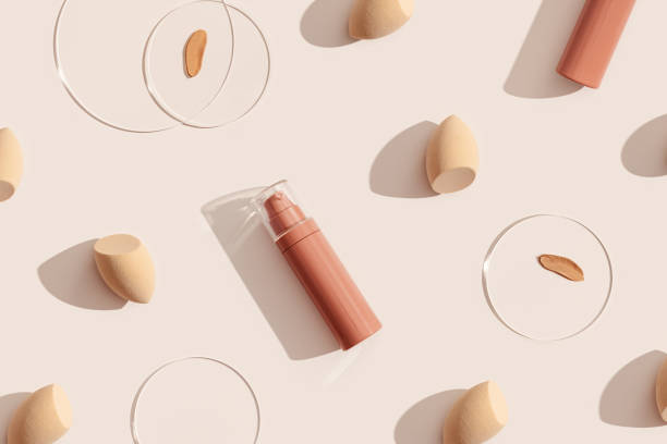 Various makeup primer products and application tools arranged on a beige background.